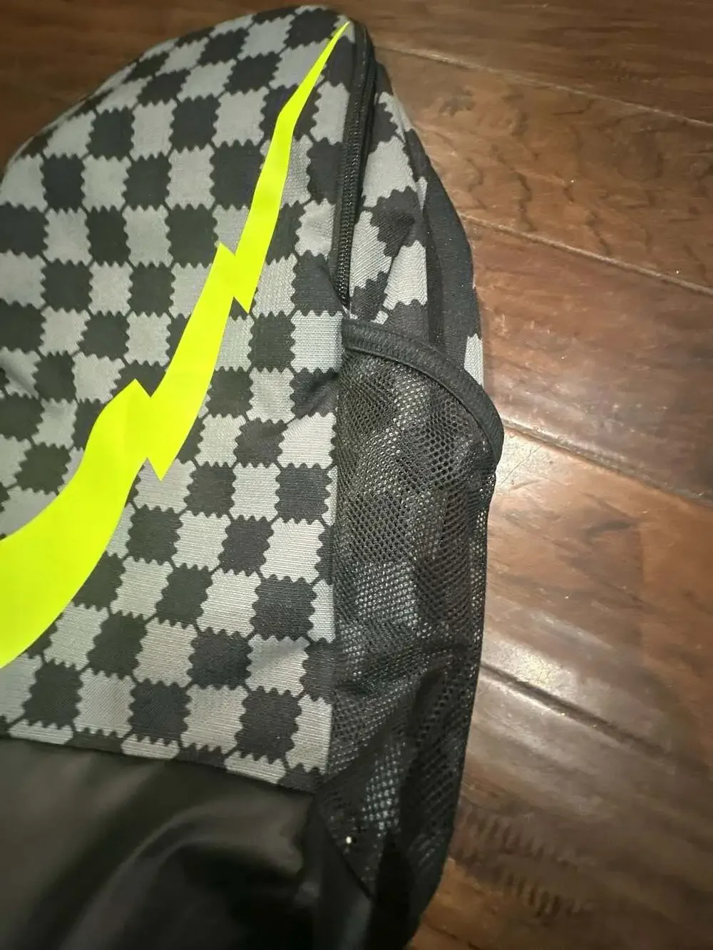 Nike Brasilia JDI Kids' Mini Backpack in Black/Grey Checkered with Volt Swoosh